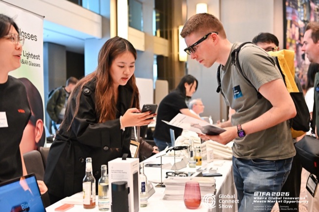 Attendees check out a product at a brand table, GCS IFA 2026